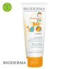 Produit de la marque Bioderma Photoderm Kid Lait Solaire Enfants Spf50 - 100ml sur un fond blanc avec un logo Parachezvous et celui de de la marque Bioderma