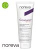 Produit de la marque Noreva Cicadiane Crème Réparatrice Apaisante Spf50 - 40ml sur un fond blanc avec un logo Parachezvous et celui de de la marque Noreva